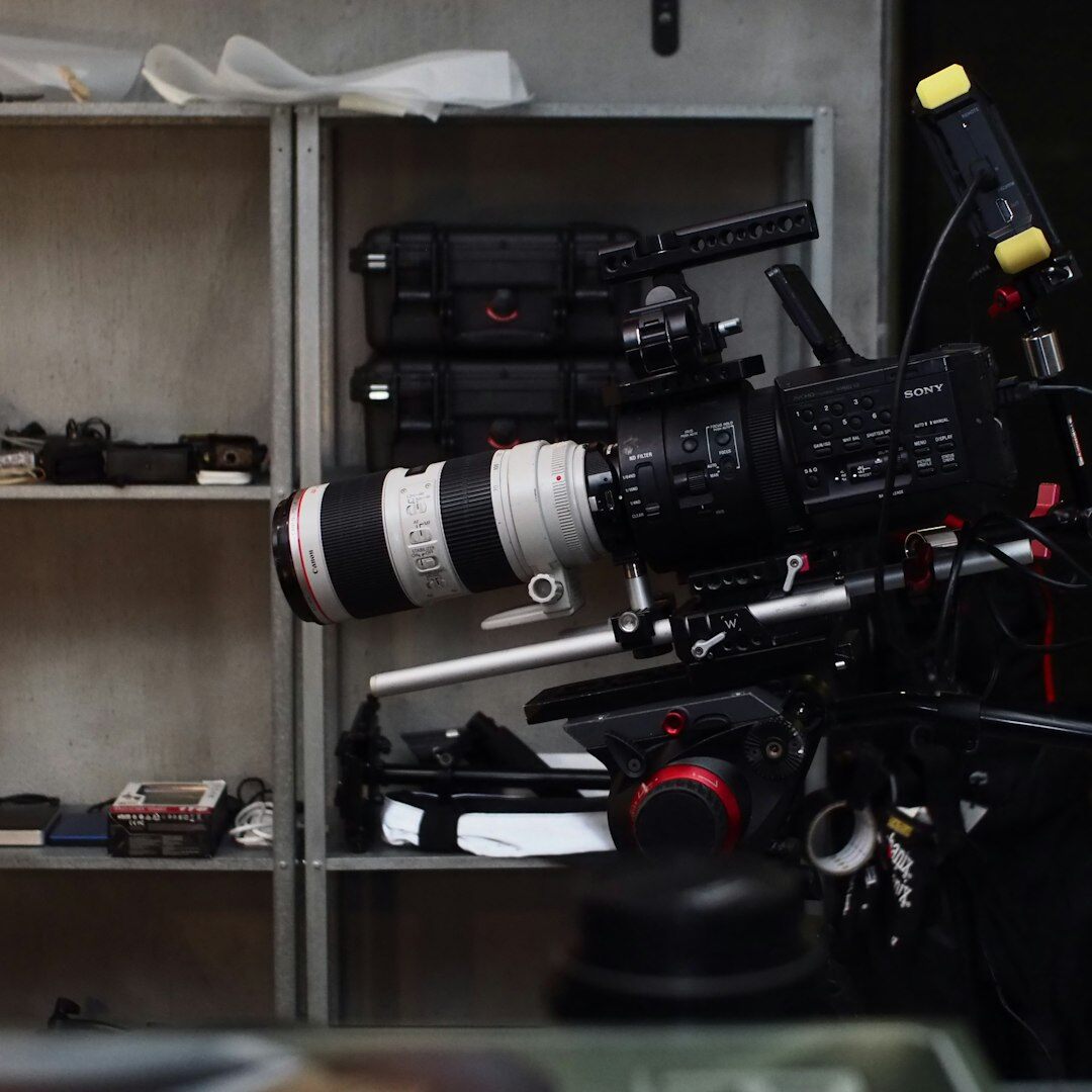 Camera operator filming with a professional video camera