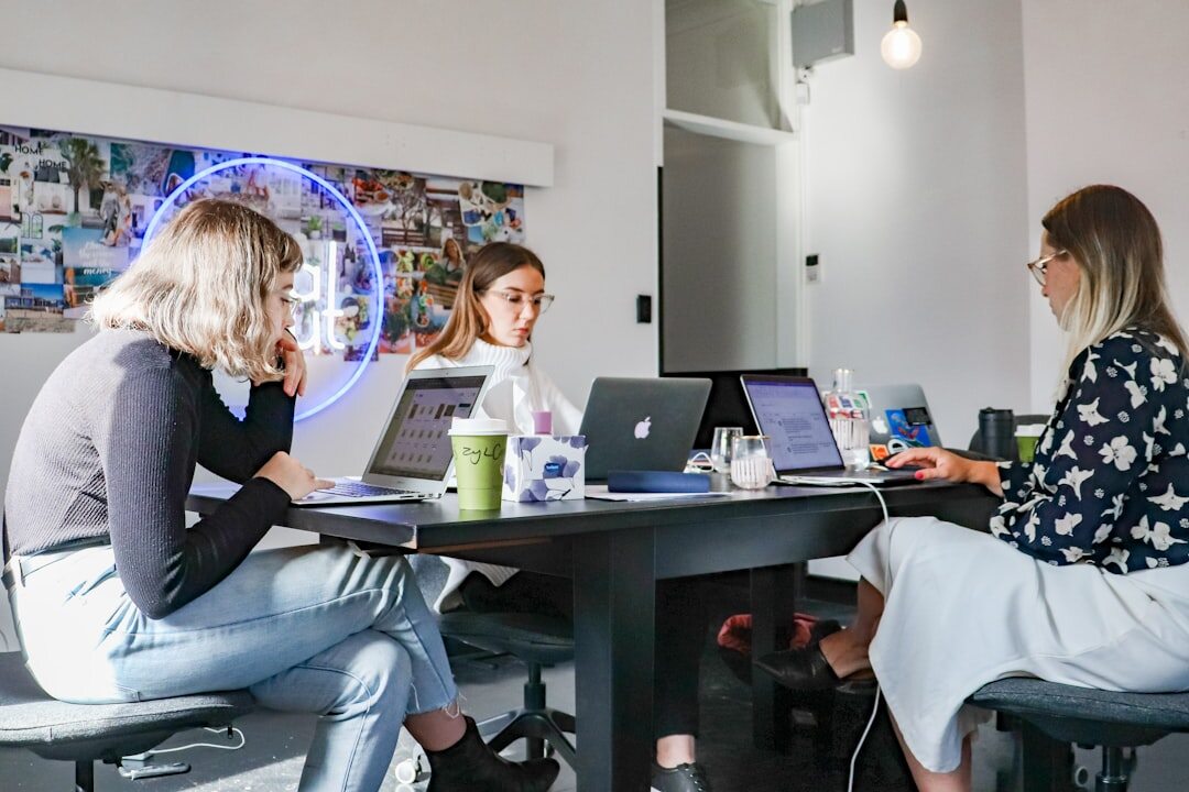 Diverse team collaborating around a newsroom table