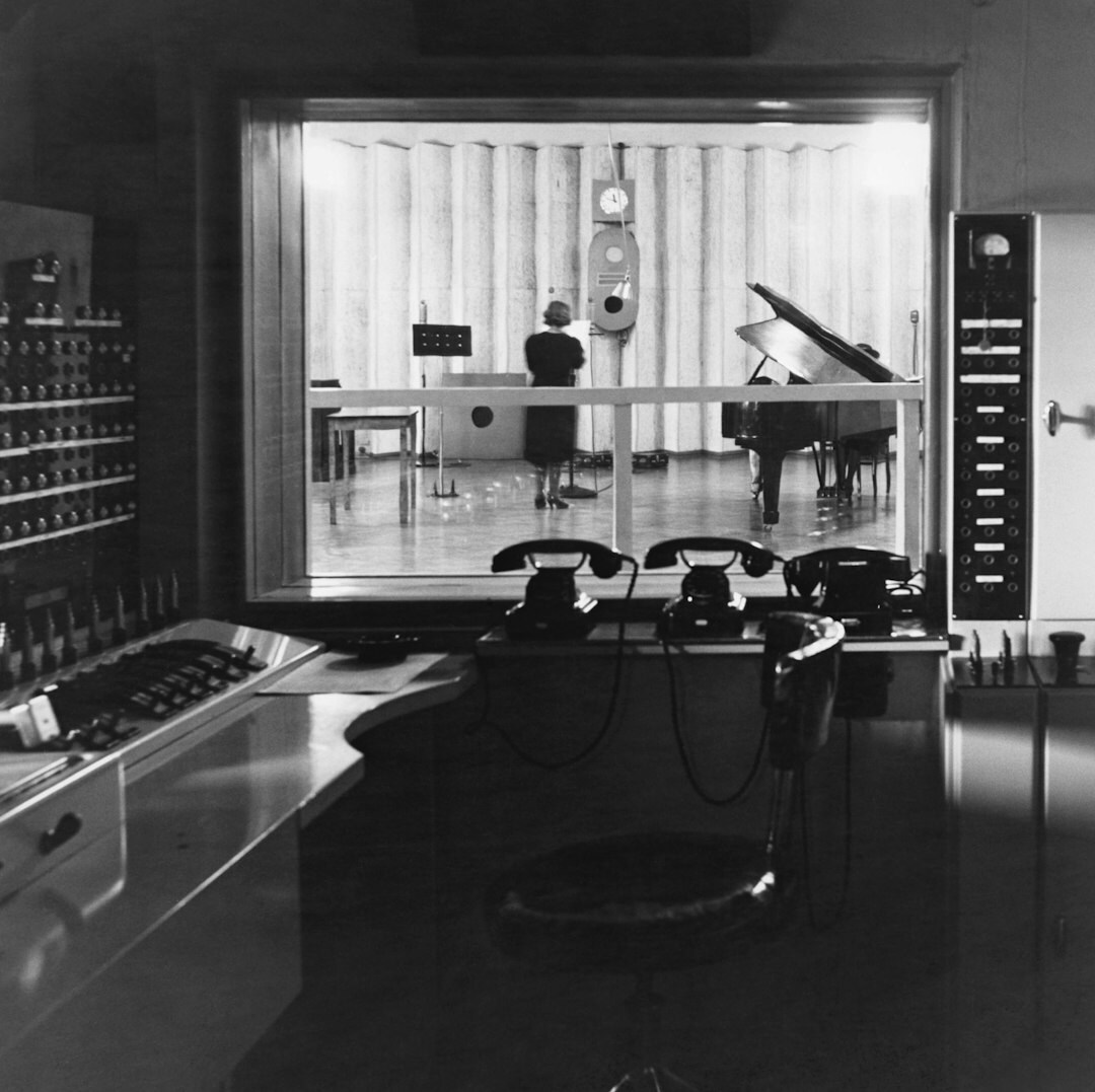 Broadcast control room with multiple monitor screens